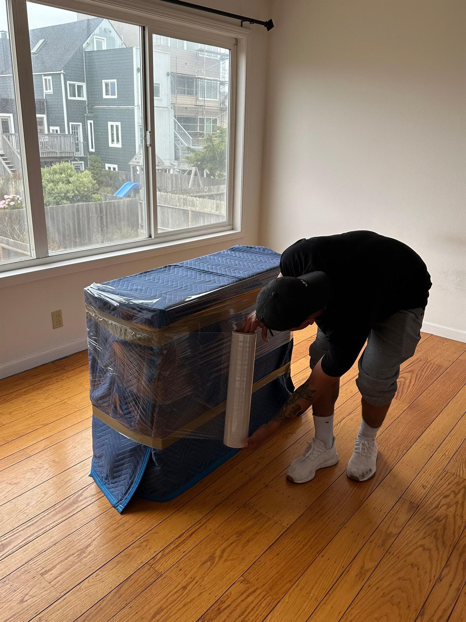 transportation — JH Moving team wrapping and loading